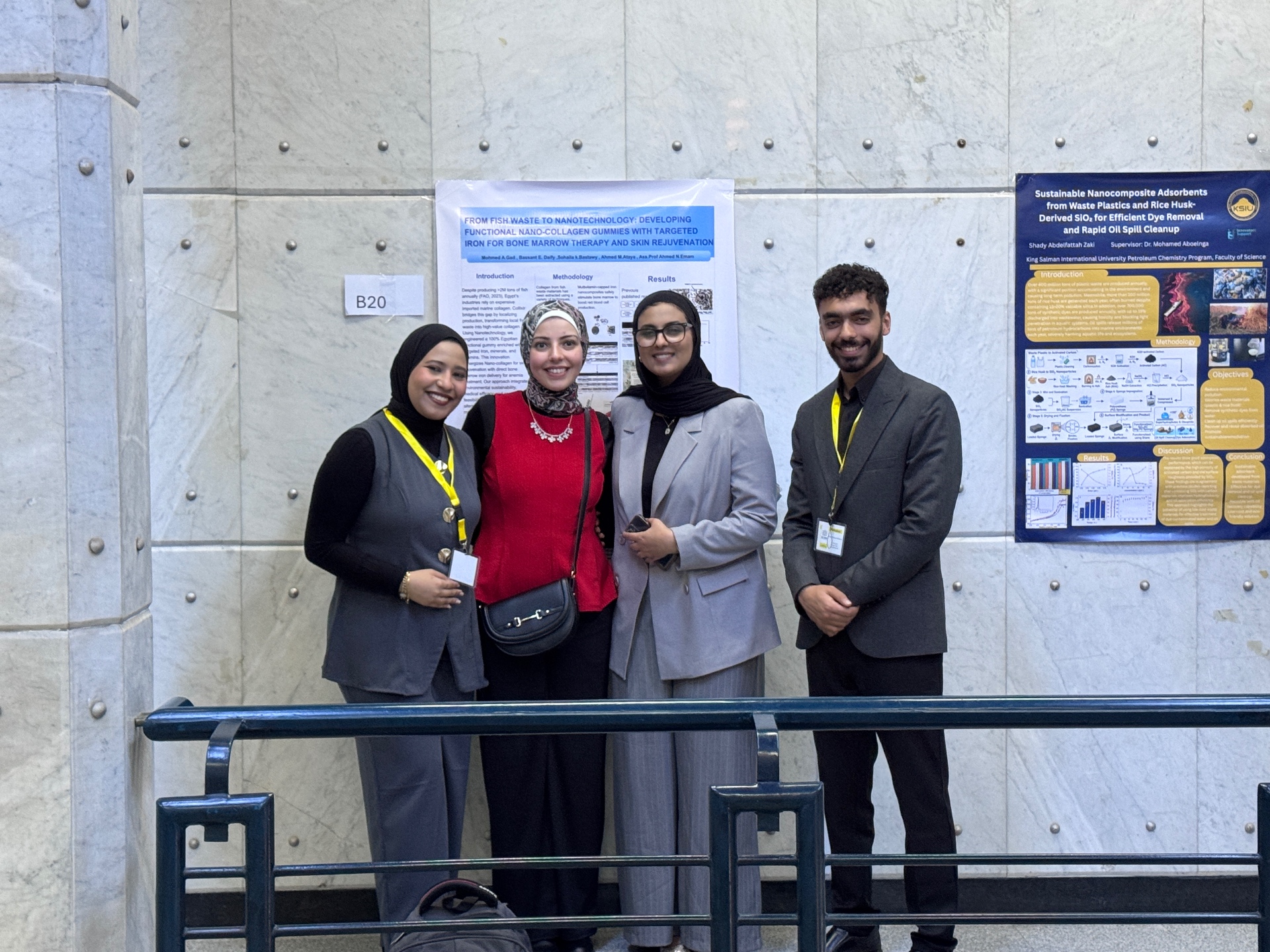 Students standing beside research posters during the SCI2026 Conference